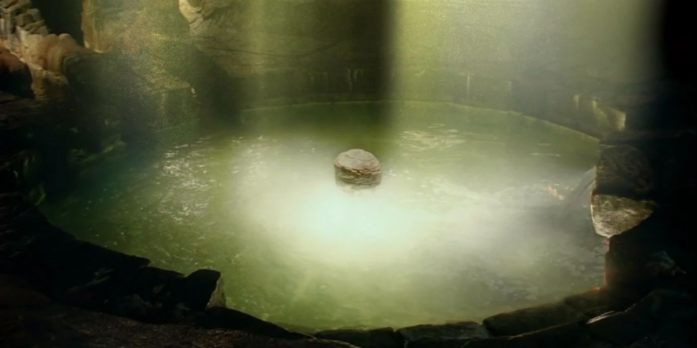 Un bouchon inséré au cœur de l'île, entouré d'une lumière éclatante, dans Lost.